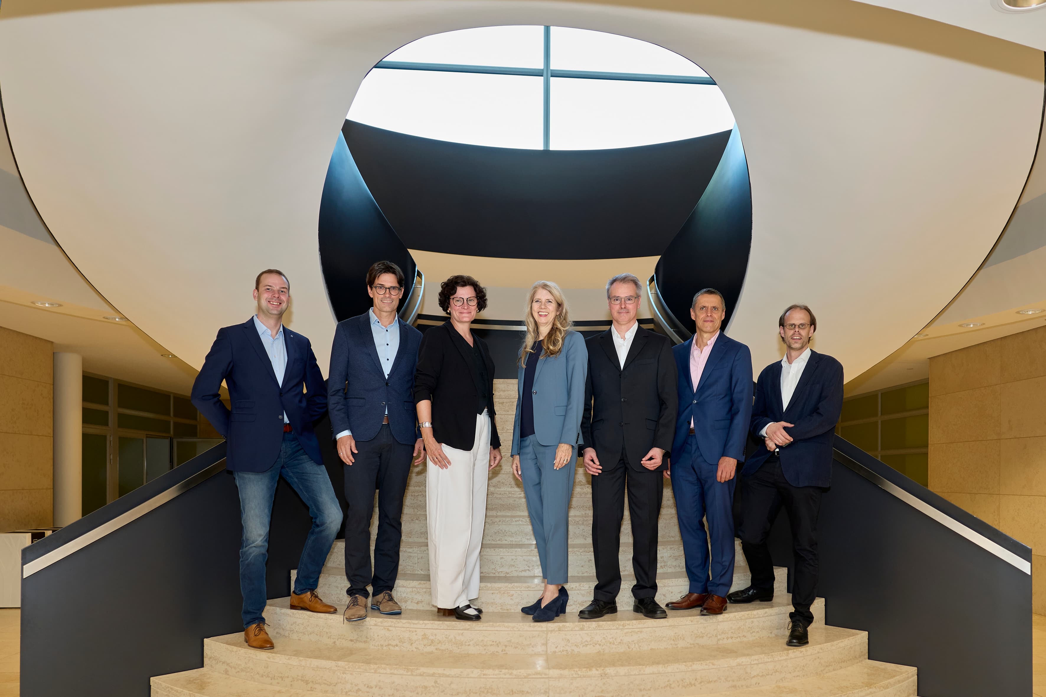 Members of the DGPs Congress organising committee pose for a group photo inside the conference venue in Luxembourg.