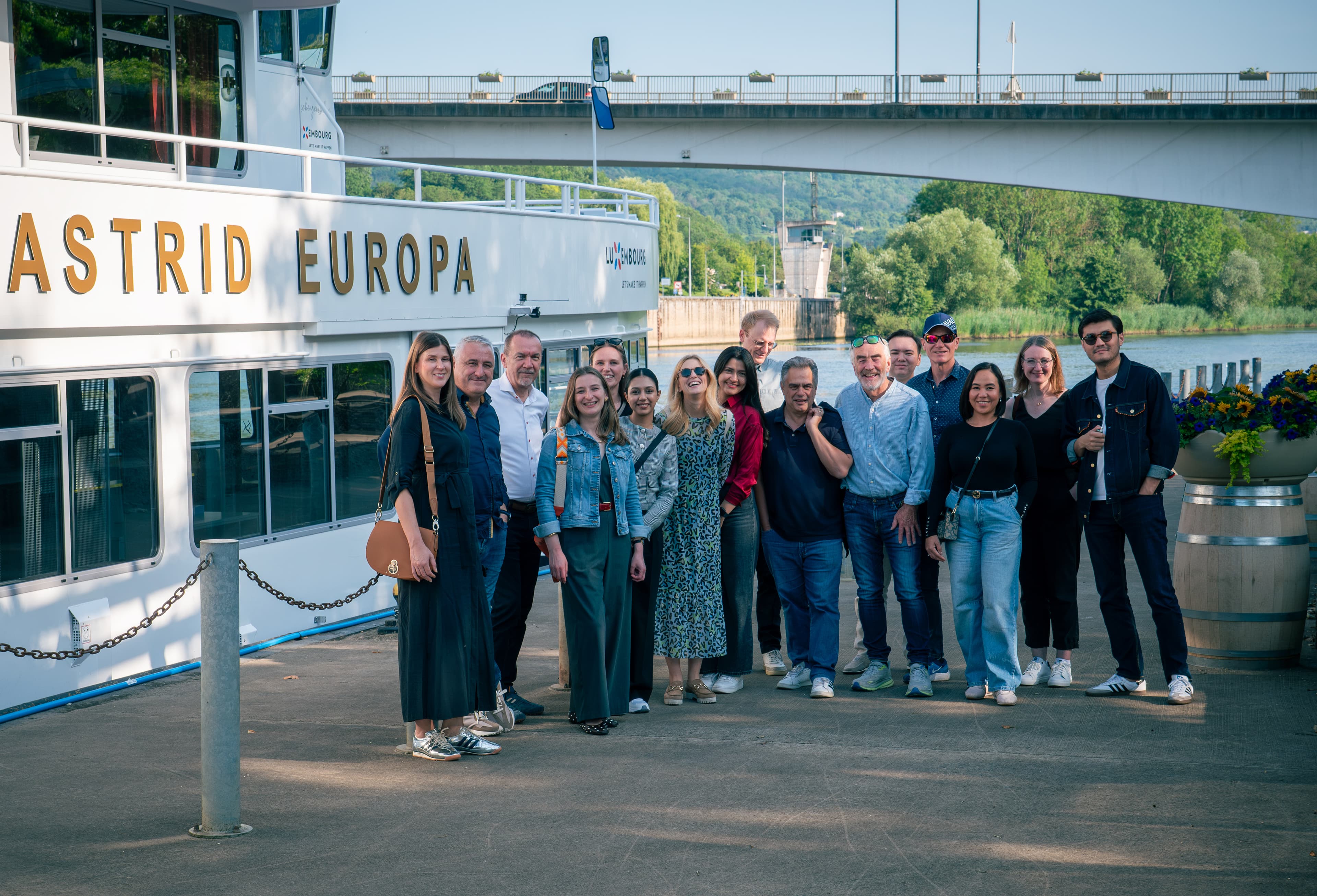 A group posing in front of the Astrid Europa river cruise boat on the Moselle